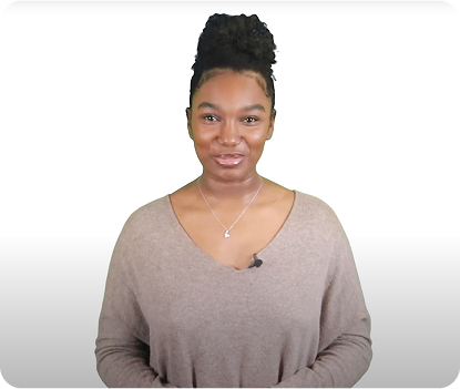 Young woman smiling confidently on white background, sharing her personal growth journey.